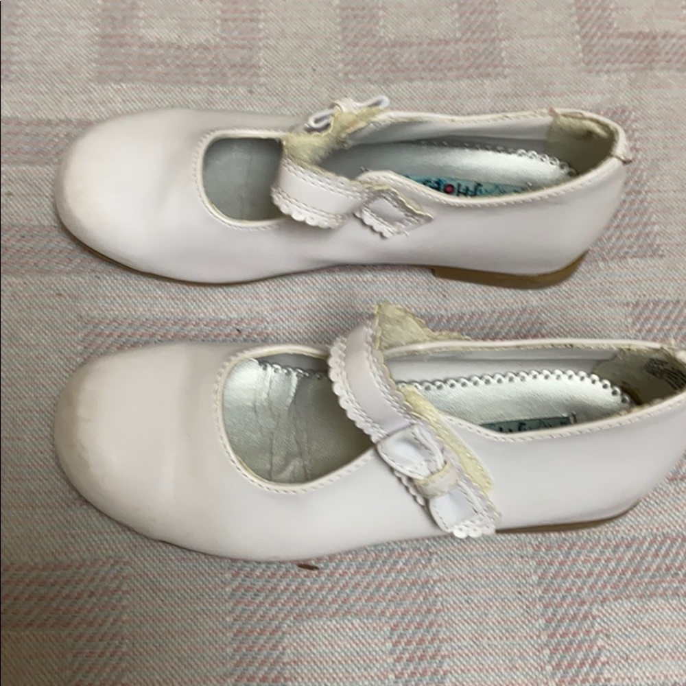 White Mary Jane shoes.